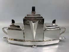 Art Deco style four piece silver plated tea set comprising teapot, milk jug and sugar bowl with