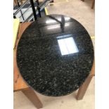 Black polished oval granite table top approx 120cm x 75cm x 2cm