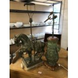 Two decorative lamp bases, one in the form of a twin handled urn, the other in the form of a horse