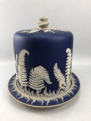 19th Century Jasperware cheese dome and stand with fine frieze of ferns on a blue background, approx