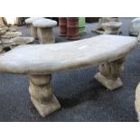 Curved stone seat on squirrel plinths