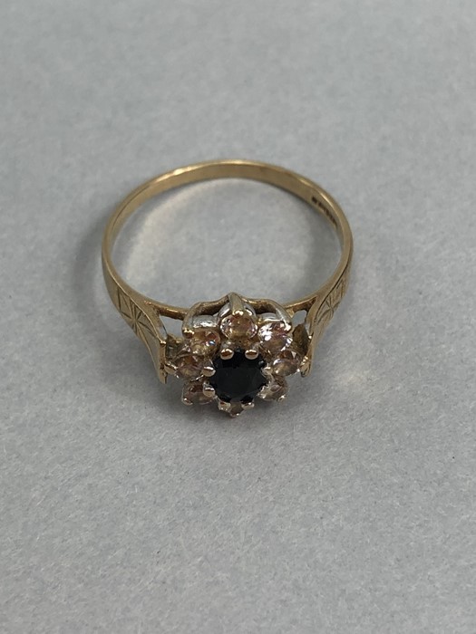 9ct Gold hallmarked Daisy ring set with an oval Sapphire and surrounded by eight Diamonds size 'N' - Image 5 of 5