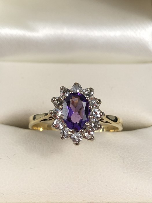 Maker Steele and Dolphin 18ct Amethyst and diamond cluster ring. The Amethyst measures approx: 7.