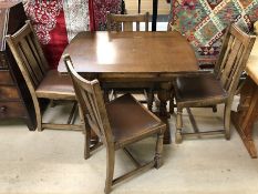 Extending refectory-style table with four chairs with padded seats