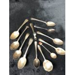 Collection of some Georgian flatware to include eleven various spoons a pair of sugar nips (approx