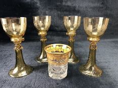 Four vintage glasses / rummers in yellow/amber with etched vine design along with a cut glass