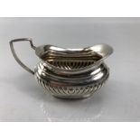 Small hallmarked silver cream/sauce jug marked Chester 1899 Maker William Aitken (approx 4cm tall at