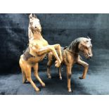 Pair of leather models of horses, one rearing