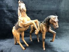 Pair of leather models of horses, one rearing