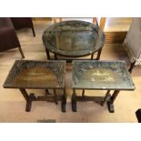 Circular tilt-top, glass topped occasional table with engraved oriental scene, approx diameter 61cm,