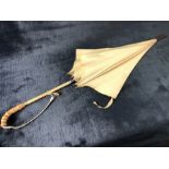 Vintage ivory coloured Paragon umbrella with cane handle and leather strap approx 90cm in length