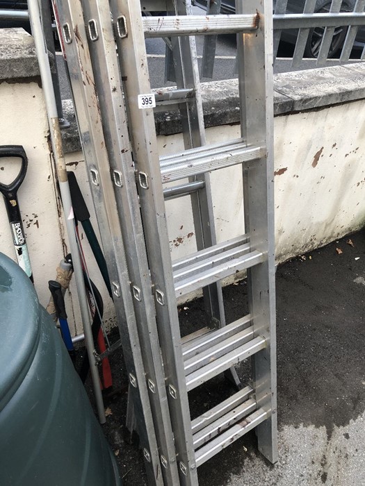 Collection of aluminium ladders and garden tools