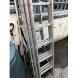 Collection of aluminium ladders and garden tools