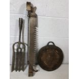 Metalware to include fireside implements and an iron flat weight with handle