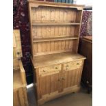 Pine dresser with two drawers and cupboards under, approx 102cm x 46cm x 182cm tall