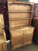 Pine dresser with two drawers and cupboards under, approx 102cm x 46cm x 182cm tall