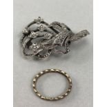 Marcasite floral spray brooch marked silver to reverse & one unmarked Gold eternity style ring (