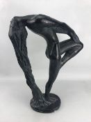 Ornamental figure of a nude lady with head thrown back and hair draping to the floor, the oval