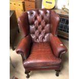 Red leather wing back Armchair A/F