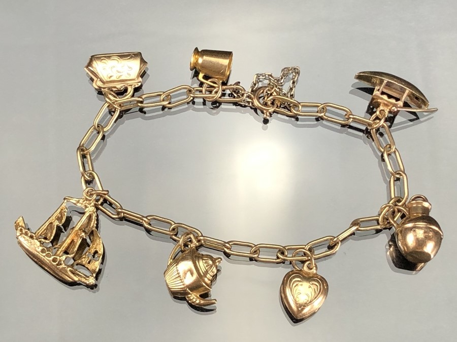9ct Gold charm bracelet with seven gold charms (the boat marked for 14ct). total weight approx 12. - Image 2 of 5
