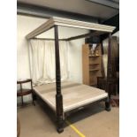 Four poster bed (5ft, king size) with turned wooden posts, cream painted top and cream back curtain