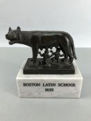 Bronze Sculpture of The Capitoline Wolf on a marble plinth with the inscription BOSTON LATIN