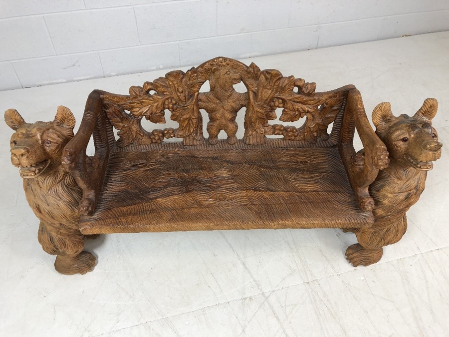 A Black forest style low bench, with two bears flanking a carved back and solid seat, approx 120cm x - Image 2 of 12