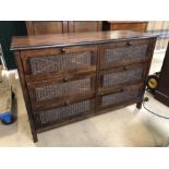 Modern dark wood six drawer chest with cane detailing to drawers, approx 123cm x 82cm x 48cm deep