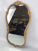 Gilt framed hourglass shaped mirror