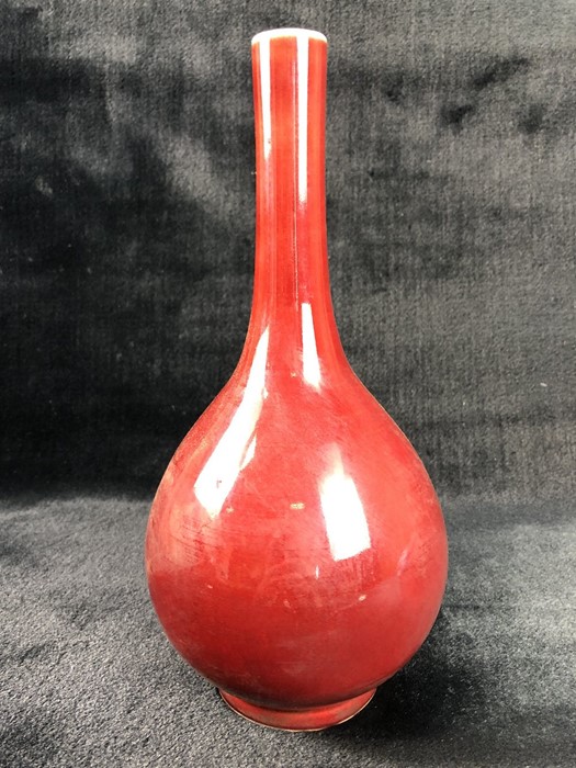 Red onion-shaped Chinese vase with white rim and base and markings to base, approx 26cm tall