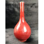 Red onion-shaped Chinese vase with white rim and base and markings to base, approx 26cm tall