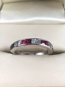 18ct White Gold ring set with Six Square cut Diamonds and 8 Princess cut Rubies, marge 750, size M