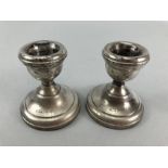 Pair of small squat candlesticks Hallmarked Birmingham by S J Rose & Son (approx 7cm tall)