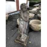 Ornamental stone garden figurine of a woman