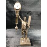 A bronze swinging pendulum mystery clock, in the from of a Pilot holding a propeller. Approx. 37cm