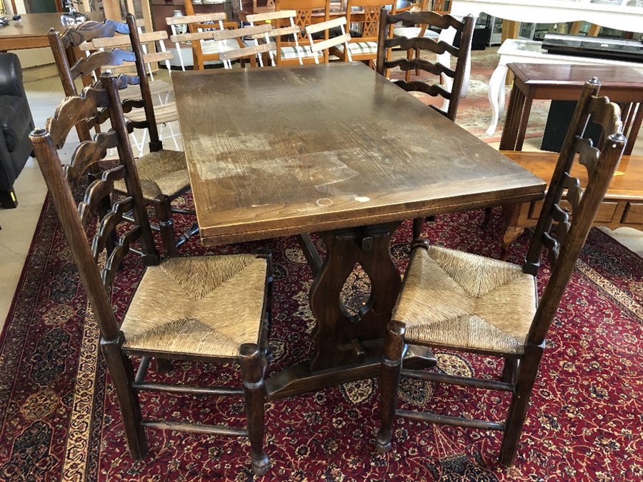 Refectory-style extending dining table with four ladder back, rush seated chairs. Table approx 206cm