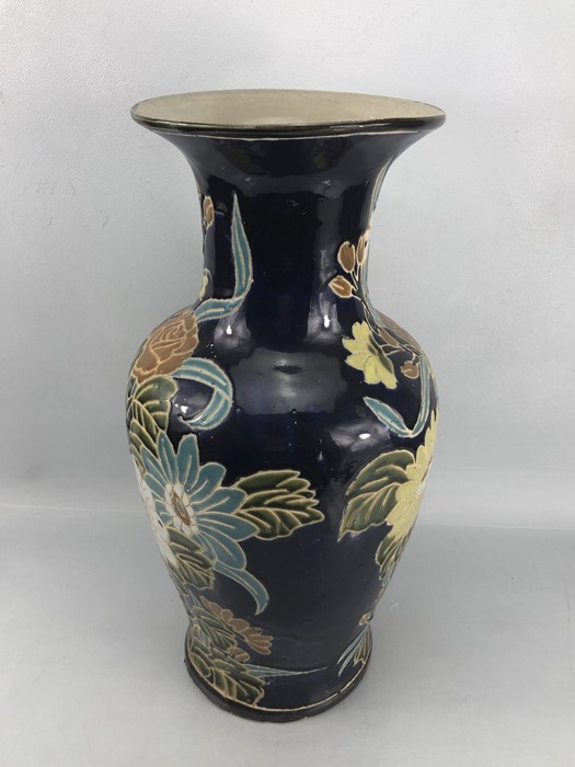 Large Chinese ceramic vase with floral design on dark blue background, approx 50cm in height (A/F) - Image 4 of 7