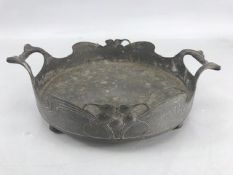 Interesting pewter tray on four ball feet in the arts and crafts style with two handles and