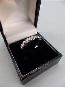 18ct White Gold Half Hoop Eternity Ring, set with 9 approx: 0.05ct Brilliant cut diamonds. Size