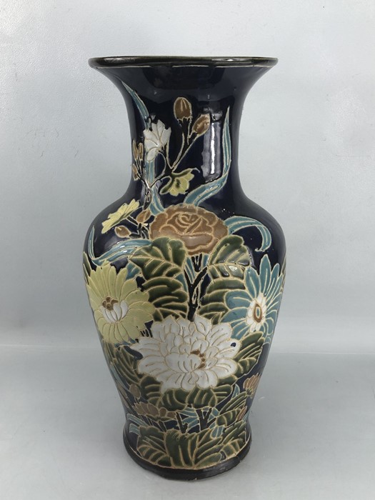 Large Chinese ceramic vase with floral design on dark blue background, approx 50cm in height (A/F)