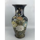 Large Chinese ceramic vase with floral design on dark blue background, approx 50cm in height (A/F)