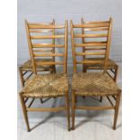 Four light wood ladder back chairs with rush seats