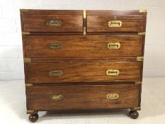 Campaign chest of five drawers with original brass fittings, approx 101cm x 44cm x 96cm