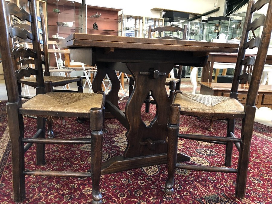 Refectory-style extending dining table with four ladder back, rush seated chairs. Table approx 206cm - Image 2 of 3