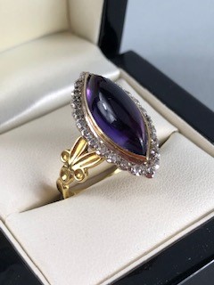 18ct Gold Marquise ring set with an Oval Amethyst stone and surrounded by square cut Diamonds