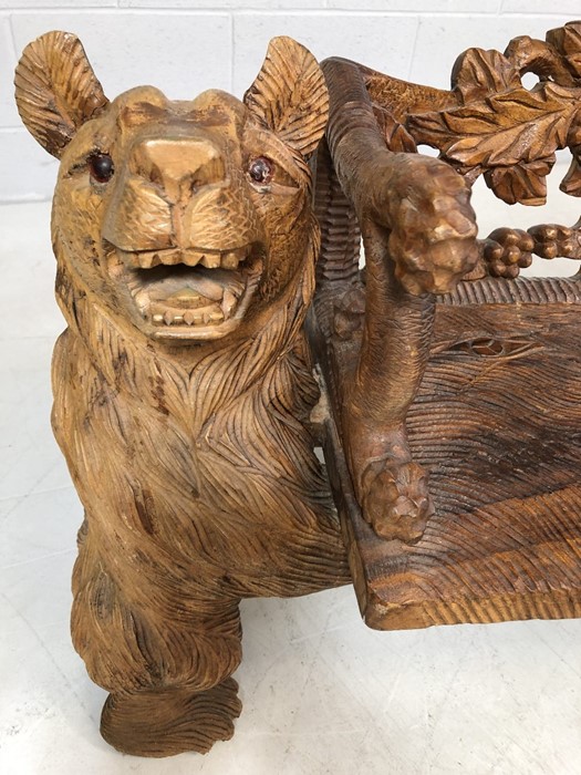 A Black forest style low bench, with two bears flanking a carved back and solid seat, approx 120cm x - Image 4 of 12