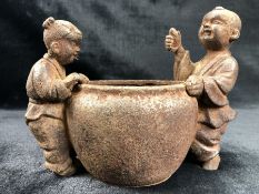 Bowl flanked by two Chinese figures, approx 21cm x 16cm