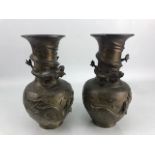 Pair of bronzed Chinese vases depicting fish and five toed dragons (A/F)