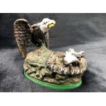 Cast metal money box in the form of a bird feeding two chicks (A/F)