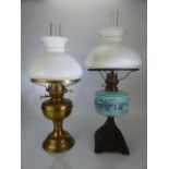 Two Victorian oil lamps with glass shades